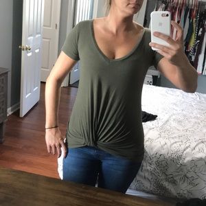 Olive green tee shirt with tie at bottom